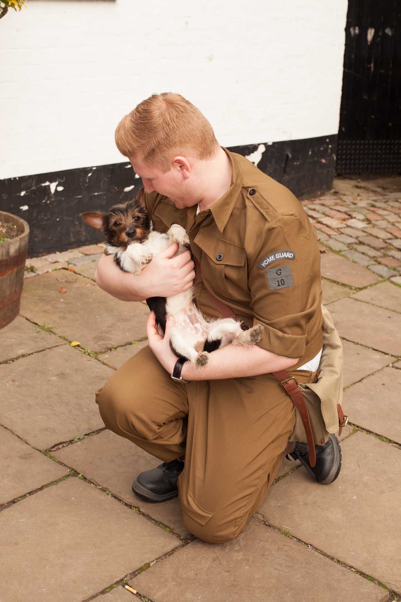 Colleague holding dog