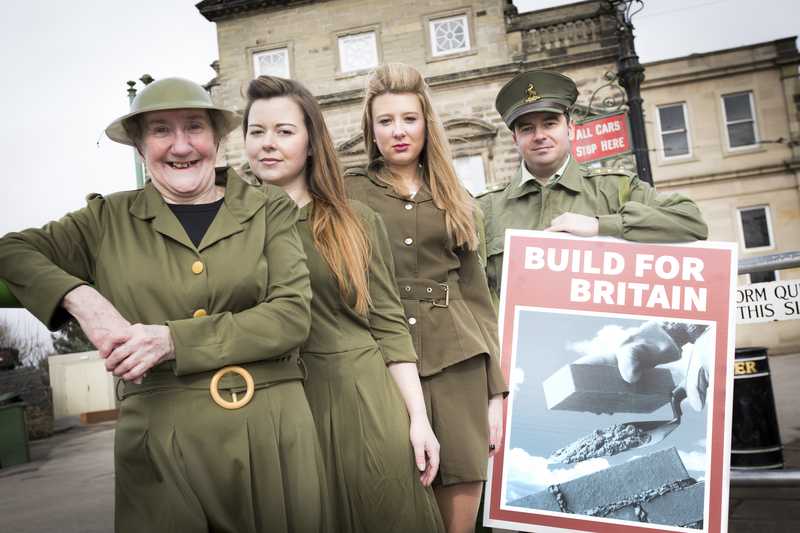 Customers and colleagues pose in WW2 costumes